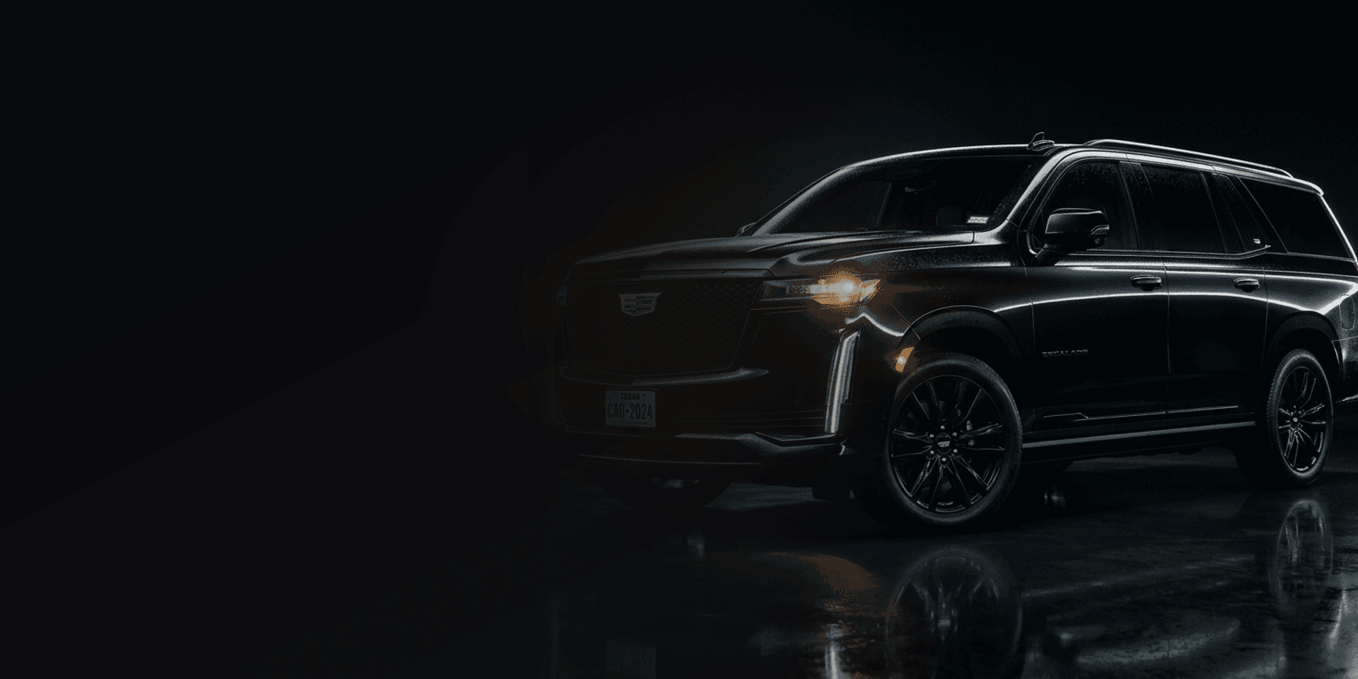 Kurbside luxury SUV under dramatic studio lighting